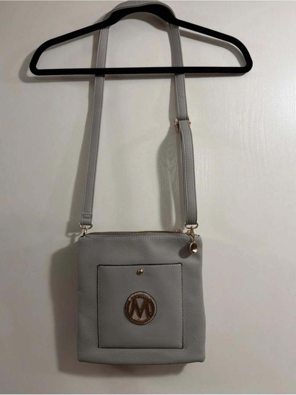 Gray Crossbody Bag with Gold M Emblem